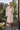 Dust pink Turkish cotton muslin robe worn with a coffee on a sunny Brooklyn balcony