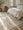 Anatolian Konfeti flat-woven kilim rug at the foot of a bed