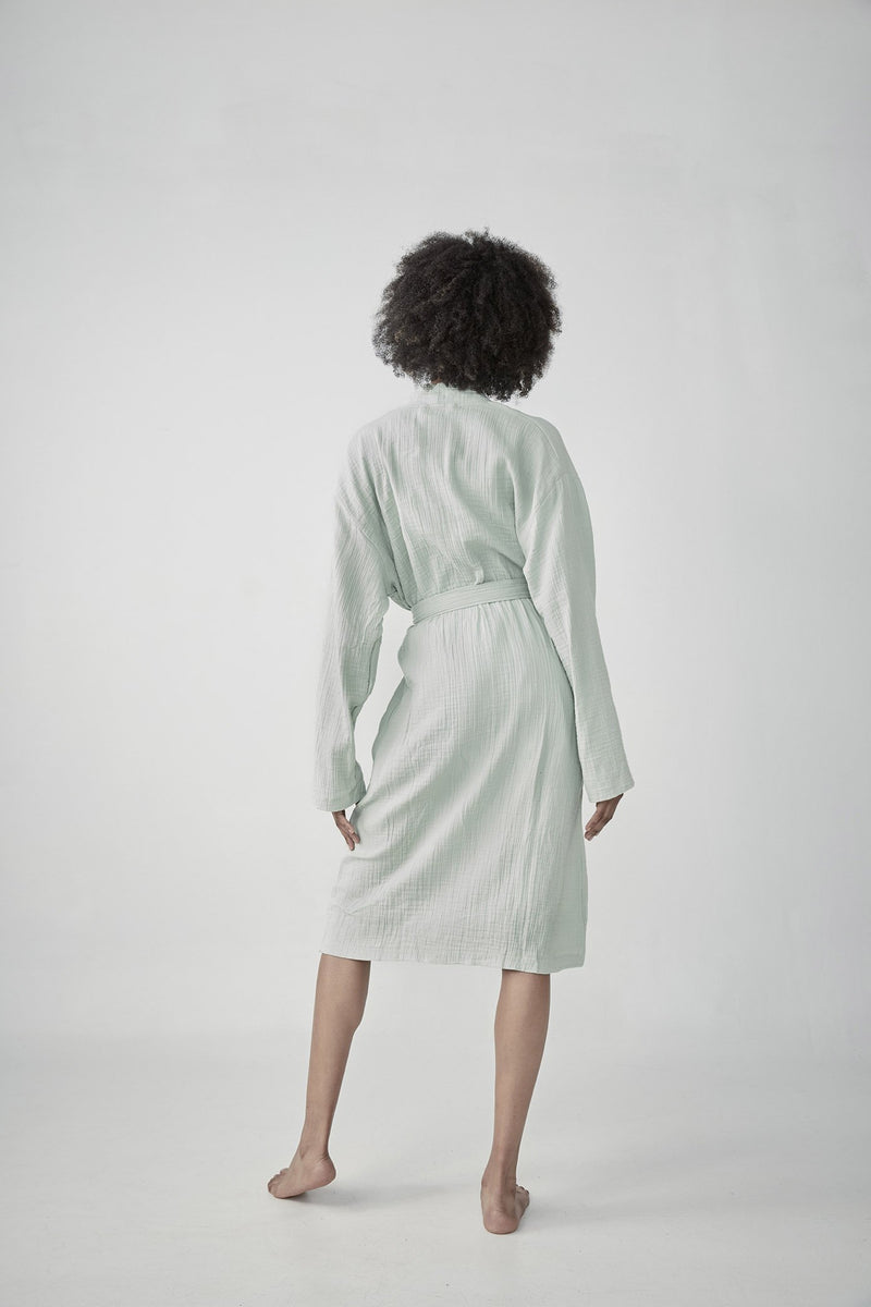 Comfortable soft lightweight matcha green Turkish cotton bathrobe with a waffle texture, ideal for lounging,travelling featured on ReplenishGoods.com.