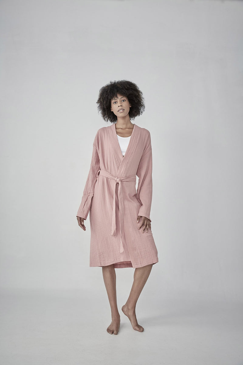Comfortable pink Turkish cotton bathrobe with a waffle texture, ideal for lounging, featured on ReplenishGoods.com.
