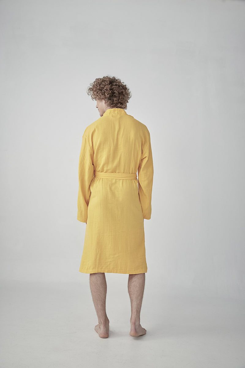 Comfortable bright yellow Turkish cotton bathrobe with a waffle texture, ideal for lounging, featured on ReplenishGoods.com.