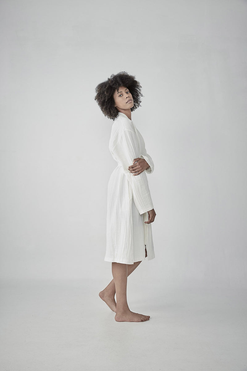 hoverComfortable cloud white Turkish cotton bathrobe with a waffle texture, ideal for lounging, featured on ReplenishGoods.com.