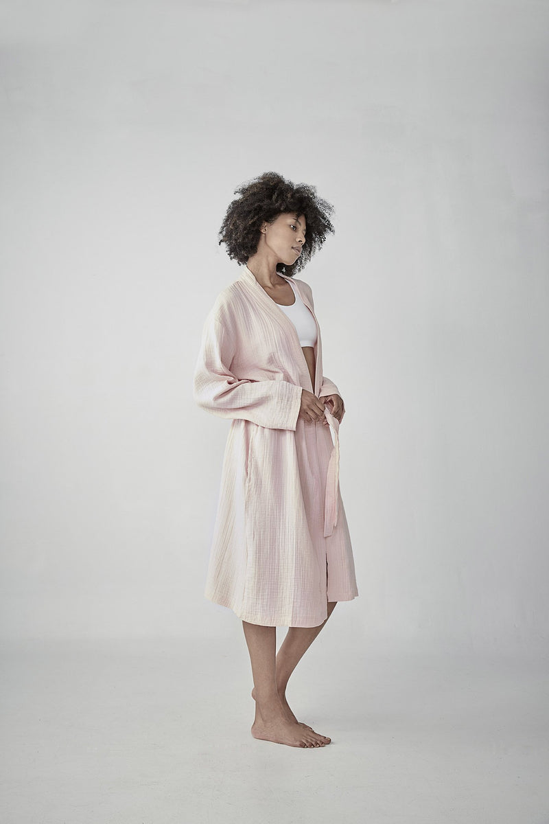 Comfortable dust pink Turkish cotton bathrobe with a waffle texture, ideal for lounging, featured on ReplenishGoods.com.